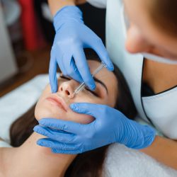 cosmetician-gives-face-botox-injections-to-patient.jpg